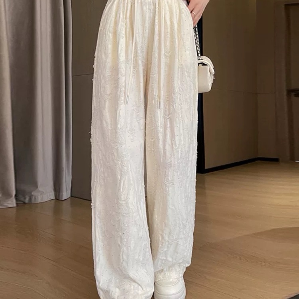 White Straight Leg Pants with High Waist and Relaxed Fit
With rhinestones